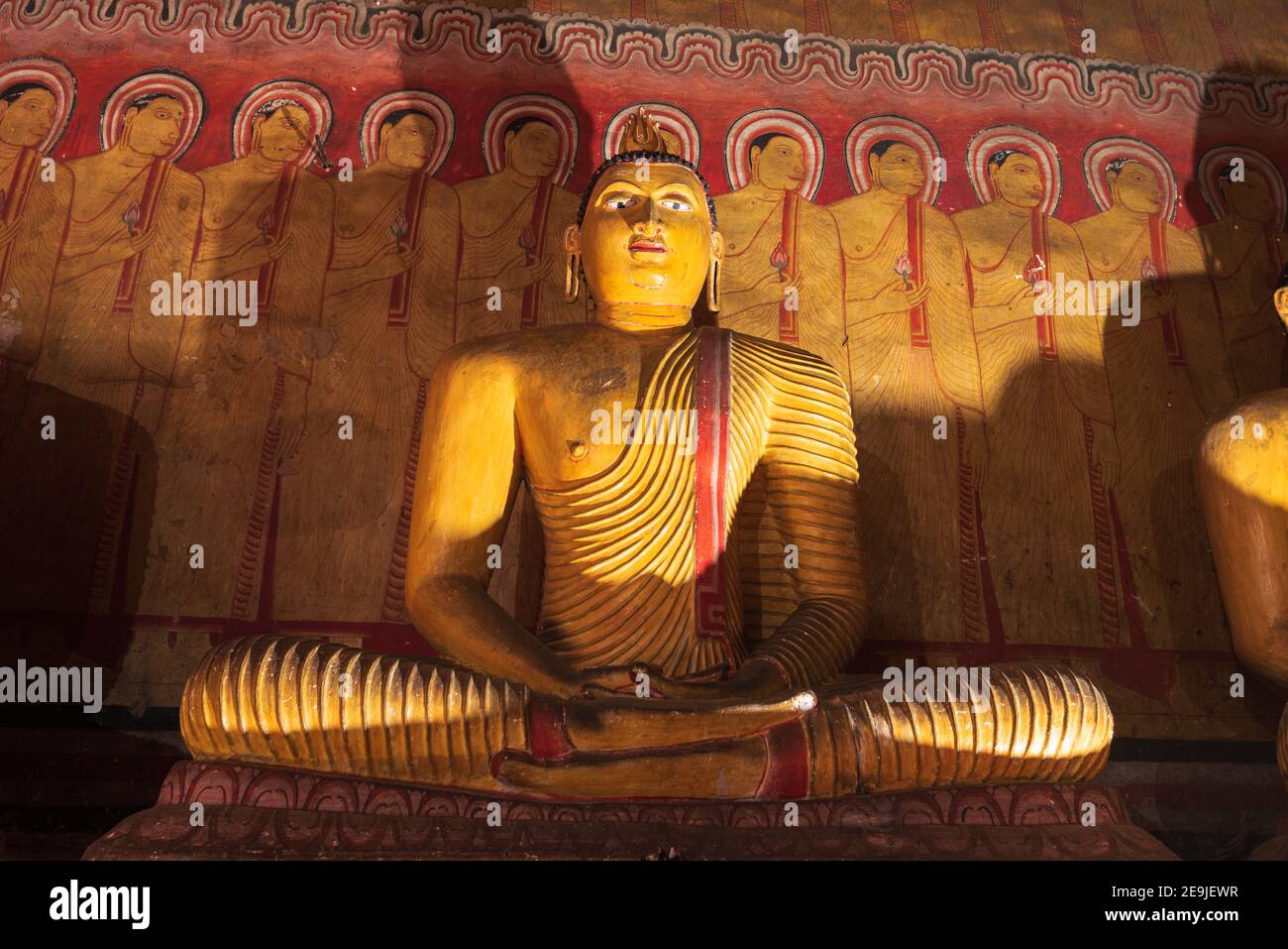 Buddha statues in Dambulla Royal Cave Temple and Golden Temple. Ancient craved rock statues, buddhist art. Famous religious place in Sri Lanka Stock Photo