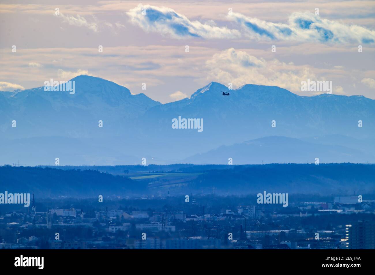 Linz, Austria, 04 Feb 2021, Boeing CH-47 Chinook of the US Army flying over the city of Linz before landing at the airport Stock Photo
