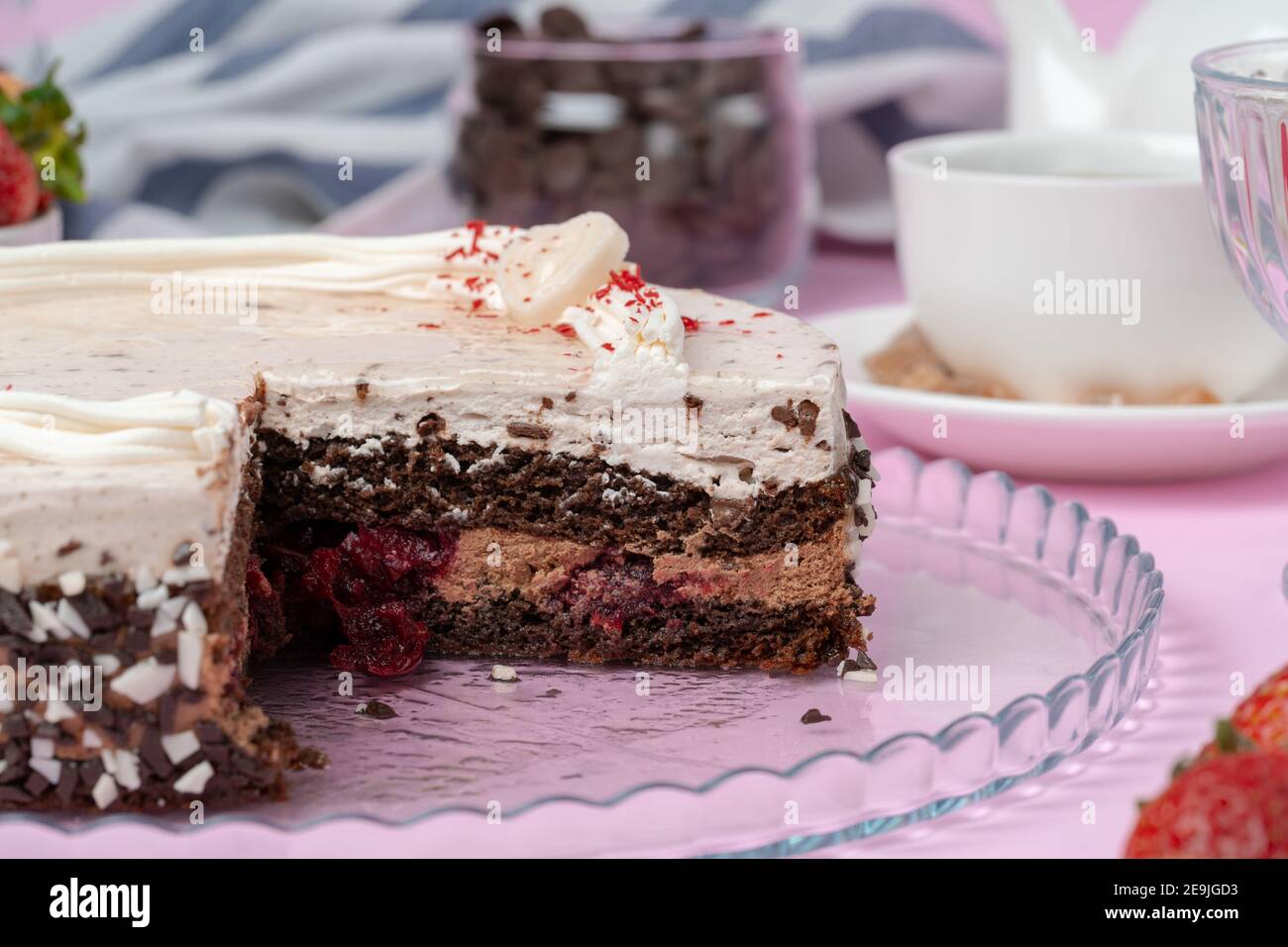 Chocolate cake with whipped cream icing on plate Stock Photo - Alamy