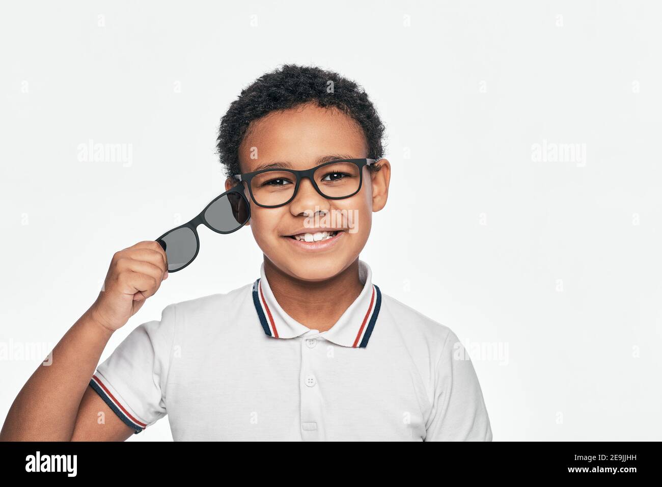 African American boy advertises sunglasses spectacles. Eyeglasses, 2 in 1 Stock Photo