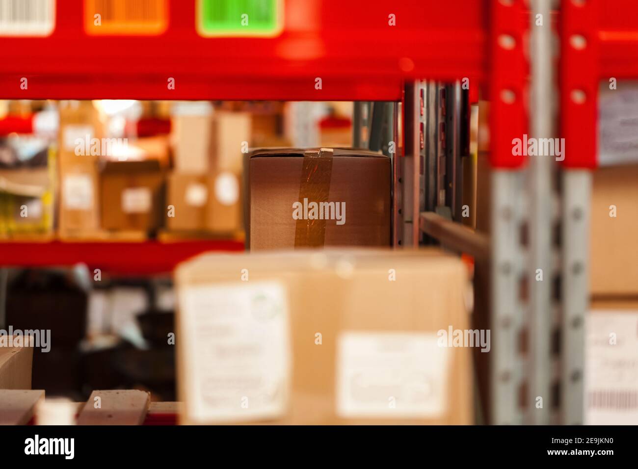Modern warehouse shelves with pile of cardboard boxes Stock Photo - Alamy