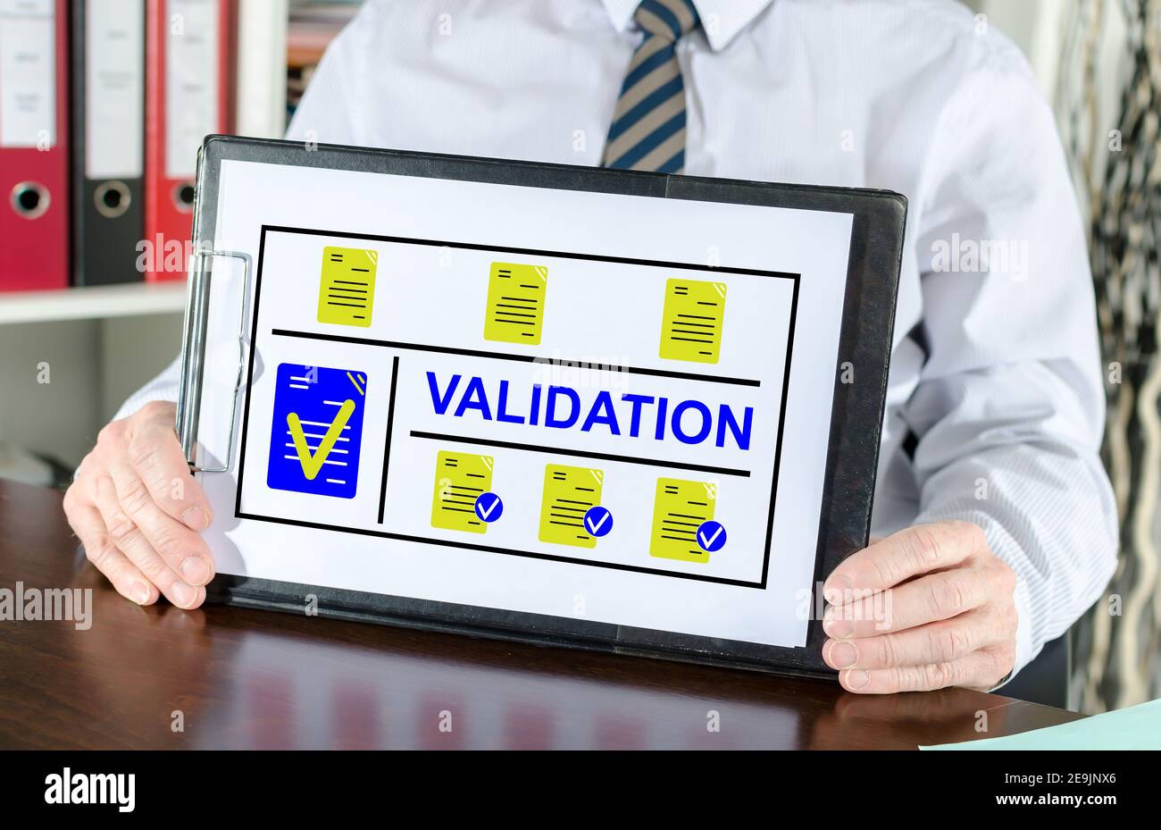 Validation concept shown by a businessman Stock Photo - Alamy