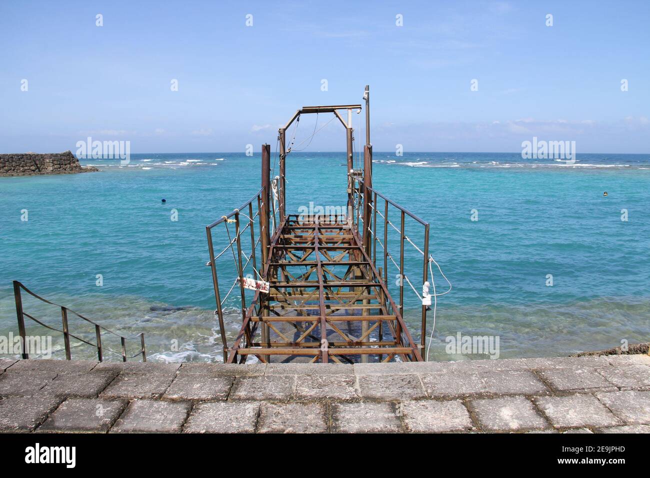 Abandoned historical pier in coast near Gala Salt Factory & Fishing Village in Yomitan Okinawa Japan Stock Photo