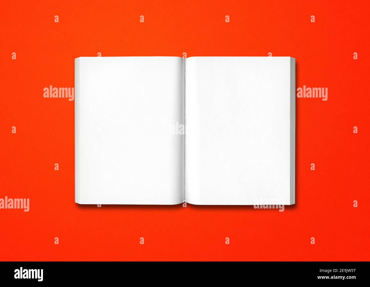 Open book isolated on a red background Stock Photo - Alamy