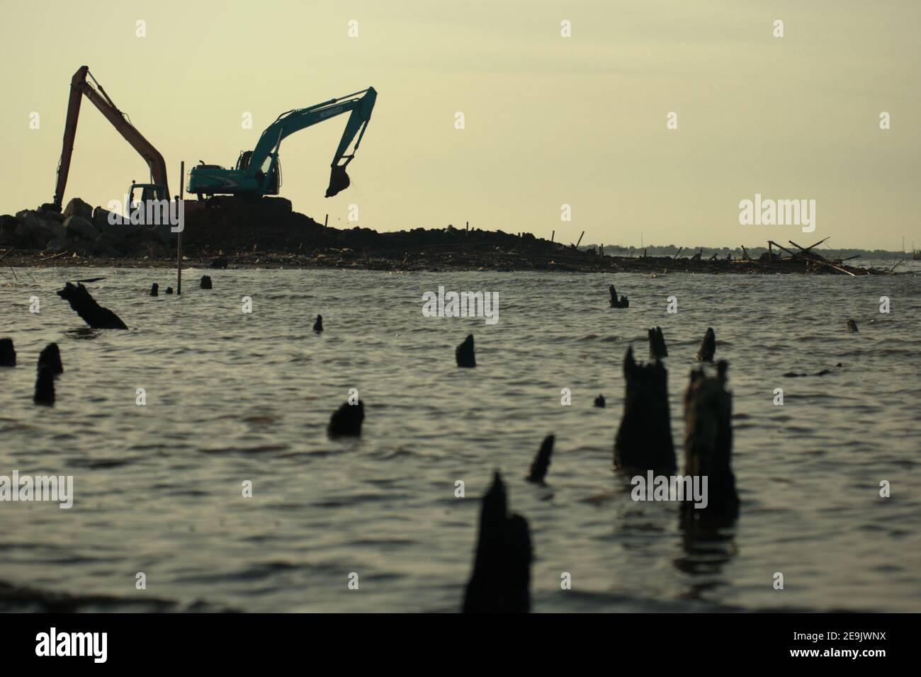 Land reclamation and beach landscaping activity in Pantai Indah Kapuk, close to a residential complex in the coastal area of Jakarta, Indonesia. Stock Photo