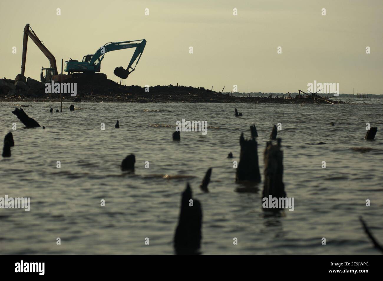 Land reclamation and beach landscaping activity in Pantai Indah Kapuk, close to a residential complex in the coastal area of Jakarta, Indonesia. Stock Photo