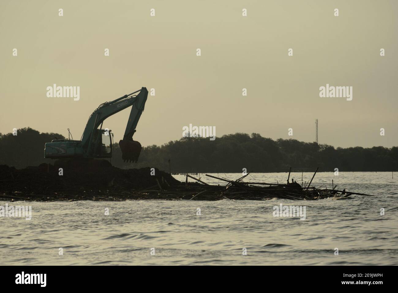 Land reclamation and beach landscaping activity in Pantai Indah Kapuk, close to a residential complex in the coastal area of Jakarta, Indonesia. Stock Photo