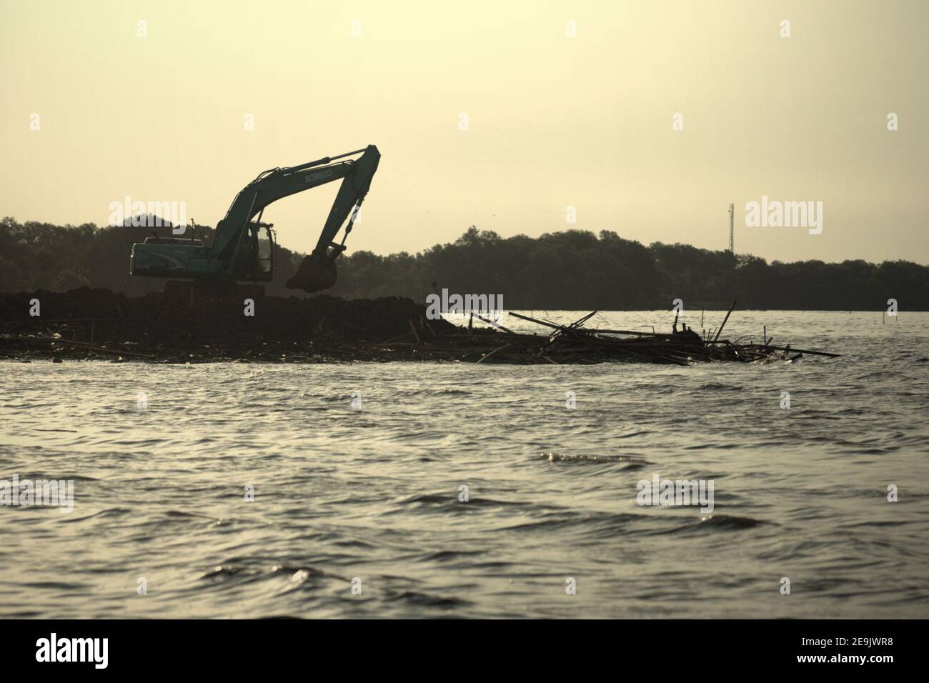 Land reclamation and beach landscaping activity in Pantai Indah Kapuk, close to a residential complex in the coastal area of Jakarta, Indonesia. Stock Photo