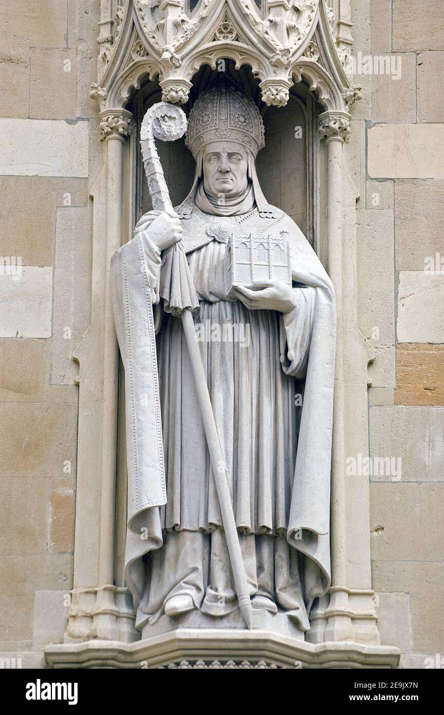 Historic monument showing the Provost of Eton, Bishop William Waynflete. Outer wall of Eton College, Windsor, Berkshire. Statue hundreds of years old, Stock Photo