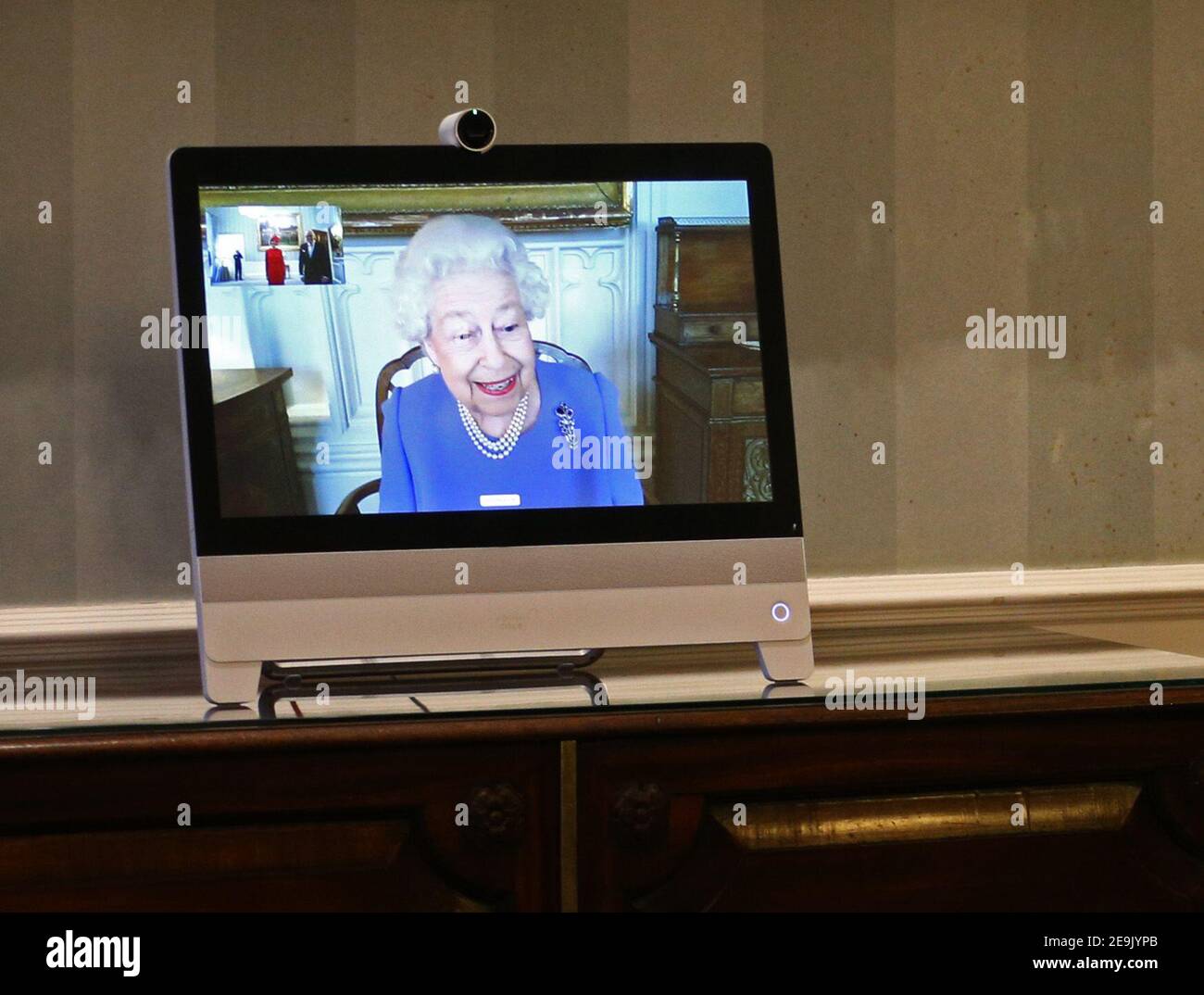 File photo dated 10/12/20 of Queen Elizabeth II appearing on a screen by videolink from Windsor Castle, where she is in residence, during a virtual audience to receive His Excellency the Ambassador of Germany Andreas Michaelis and his wife Heike Michaelis, who were at London's Buckingham Palace. The Queen will have reigned as monarch for 69 years on Saturday. Stock Photo