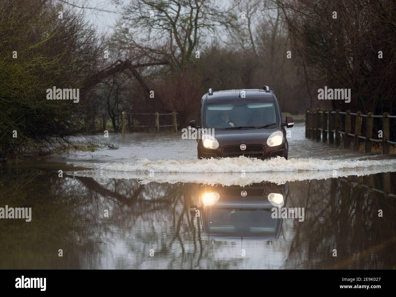 A car makes its way through a flooded road in Mountsorrel, Leicestershire. Picture date: Friday February 5, 2021. Stock Photo