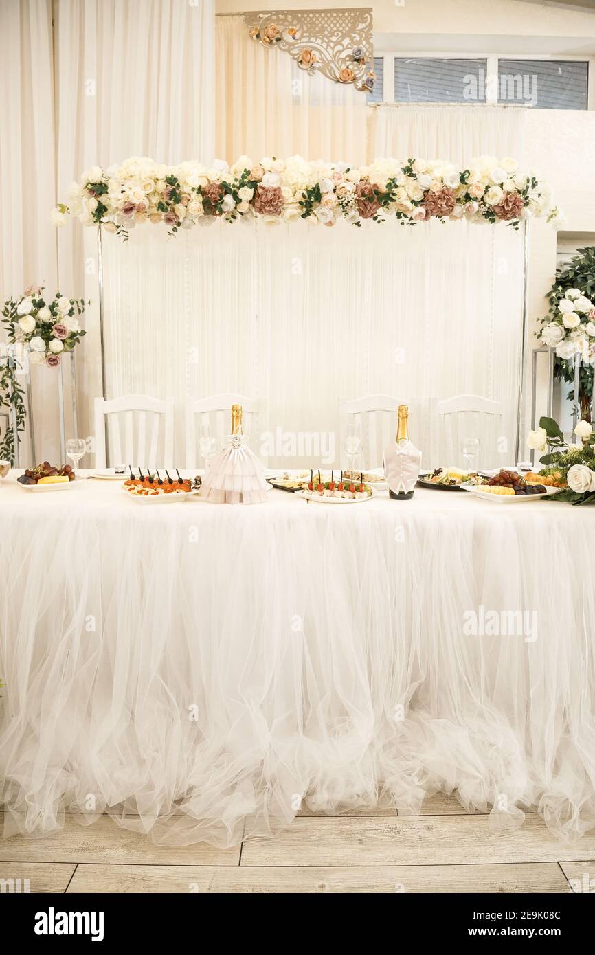 Wedding decor made of flowers and fabric. Beautiful decorations for