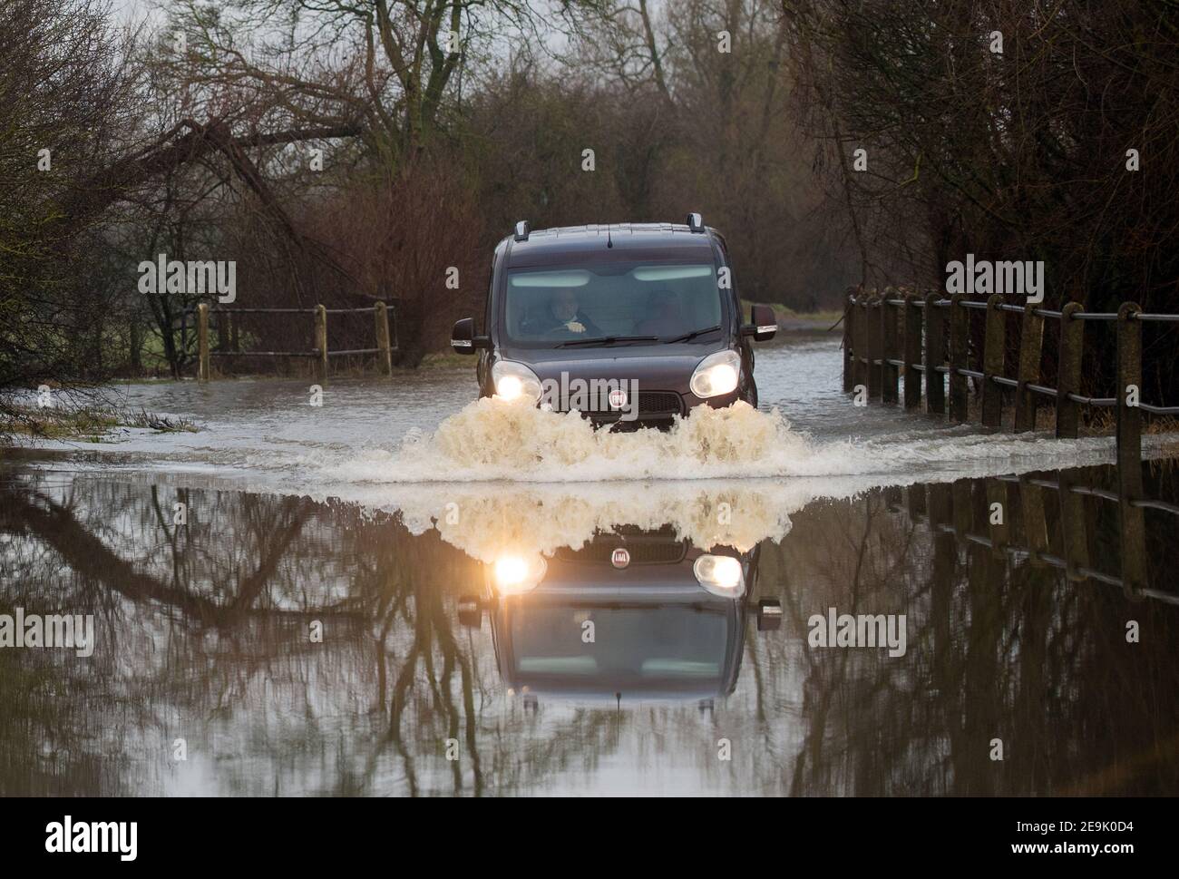 A car makes its way along a flooded road in Mountsorrel, Leicestershire. Picture date: Friday February 5, 2021. Stock Photo