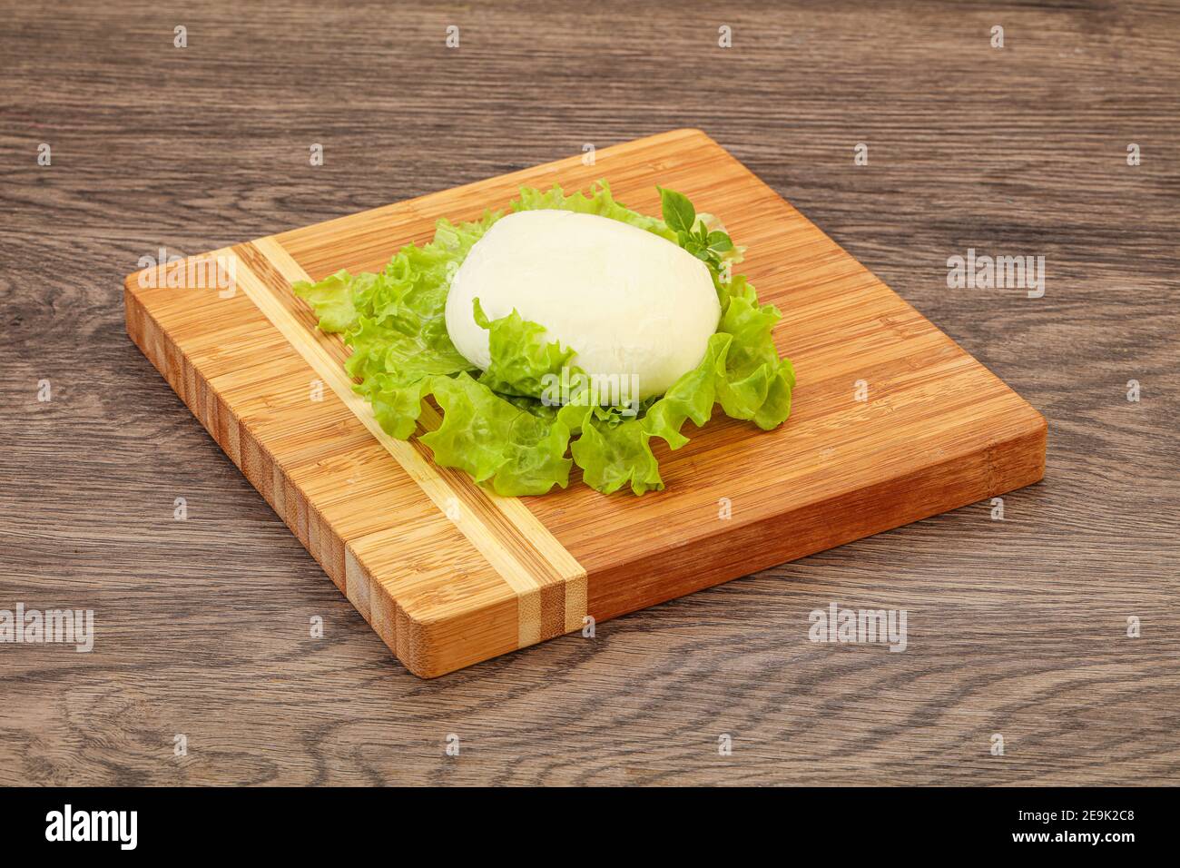 Italian Mozzarella cheese ball over board Stock Photo Alamy