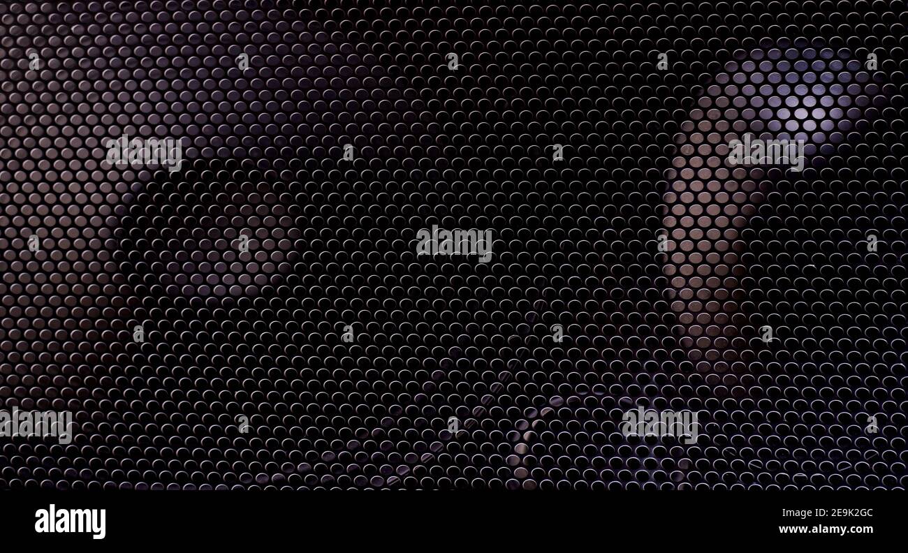 Black grille texture as a background. Stock Photo