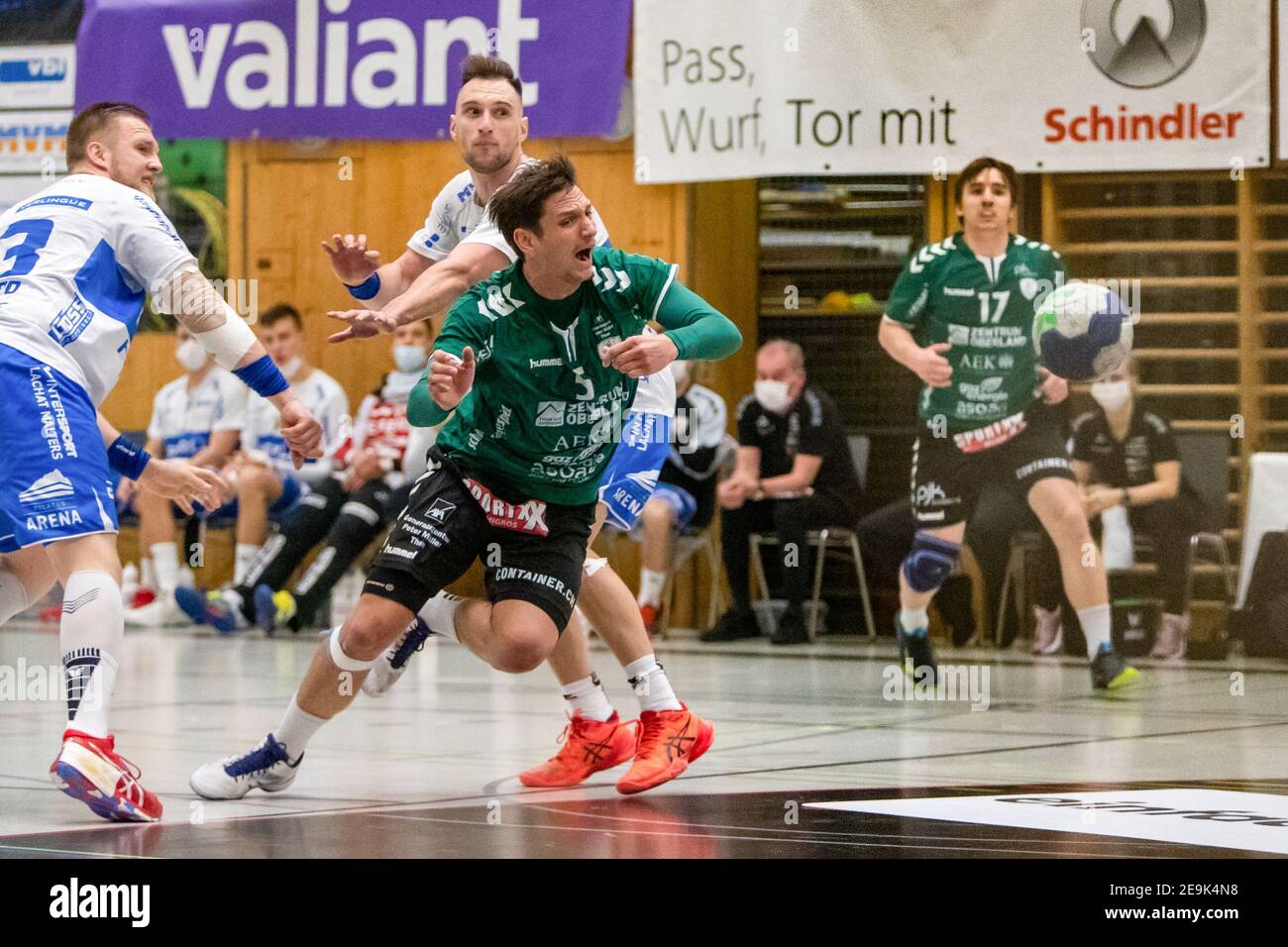 04.02.2021, Kriens, Krauerhalle, MNLA - handball: HC Kriens-Luzern - Wacker  Thun, # 5 Nicolas RAEMY (Thun) prevails against # 23 Gino DELCHIAPPA  (Kriens-Luzern) and # 87 Janus LAPAJNE (Kriens-Luzern Stock Photo - Alamy