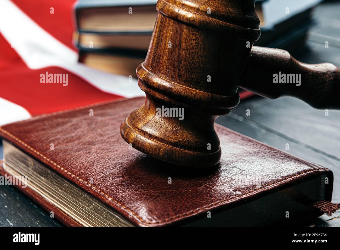 Image of wooden judge hammer on notepad Stock Photo