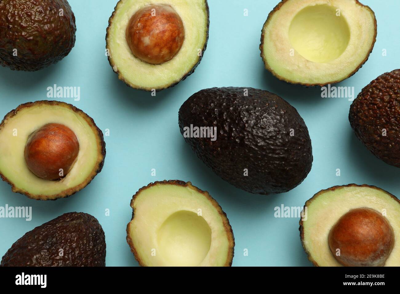 Ripe avocado on blue background, top view Stock Photo