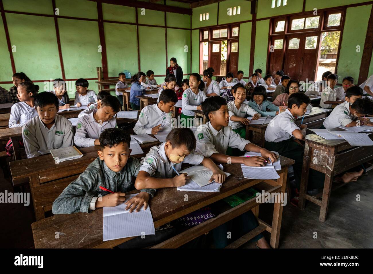 The orphans living in the Shatapru Education Boarder orphanage in Myikyina in Northern Myanmar attend classes in the government school. Stock Photo