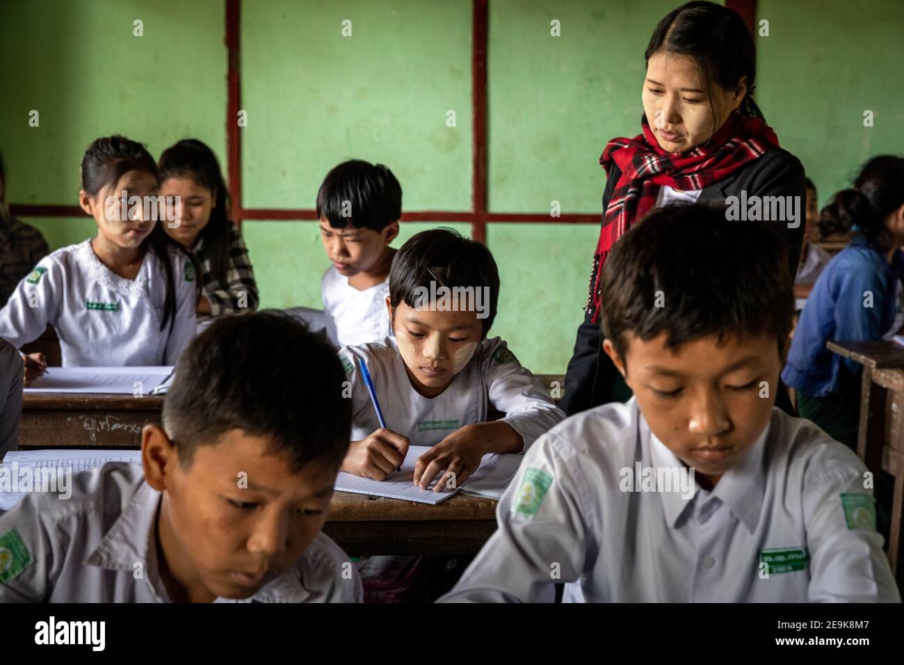 The orphans living in the Shatapru Education Boarder orphanage in Myikyina in Northern Myanmar attend classes in the government school. Stock Photo