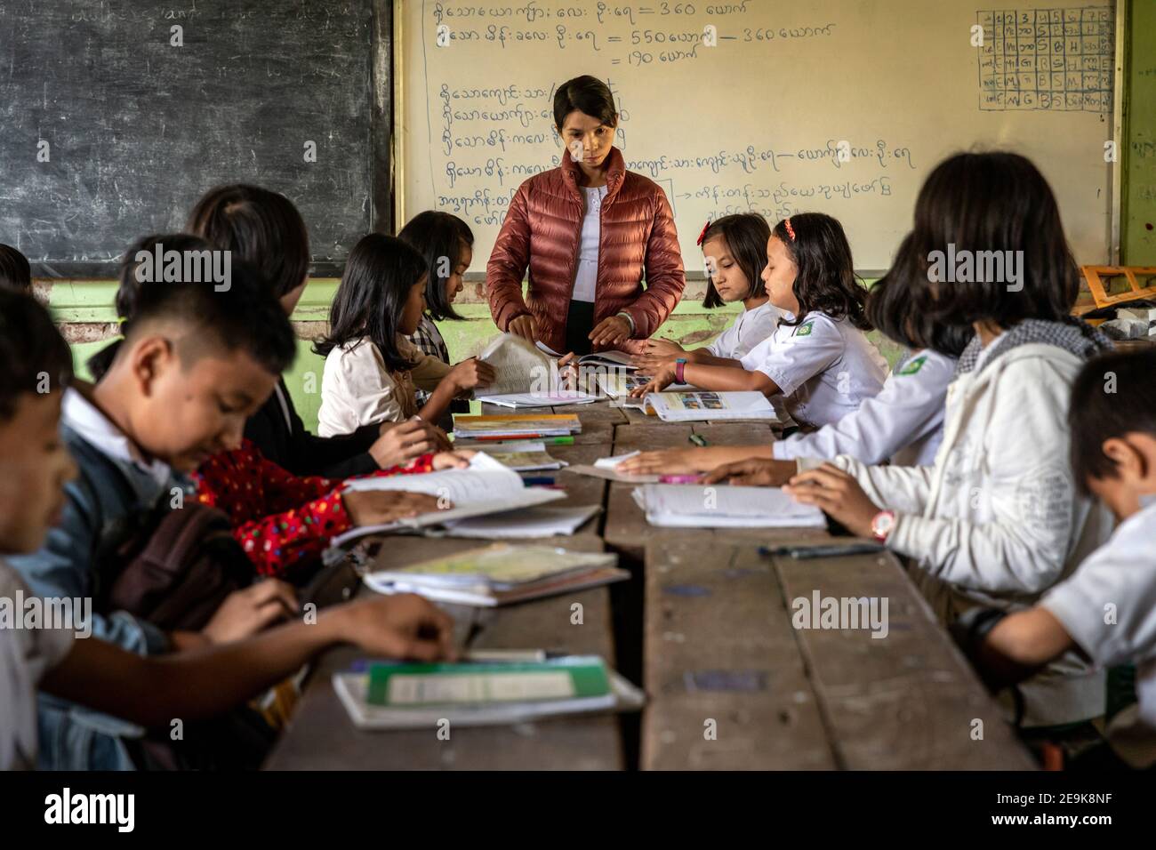 The orphans living in the Shatapru Education Boarder orphanage in Myikyina in Northern Myanmar attend classes in the government school. Stock Photo