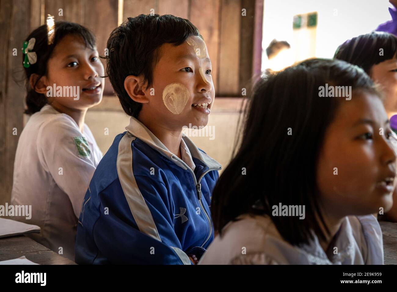 The orphans living in the Shatapru Education Boarder orphanage in Myikyina in Northern Myanmar attend classes in the government school. Stock Photo