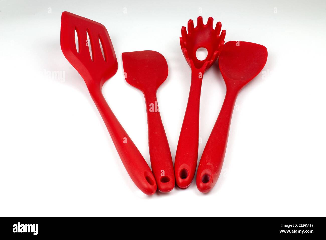 Closeup shot of red kitchen utensils Stock Photo - Alamy