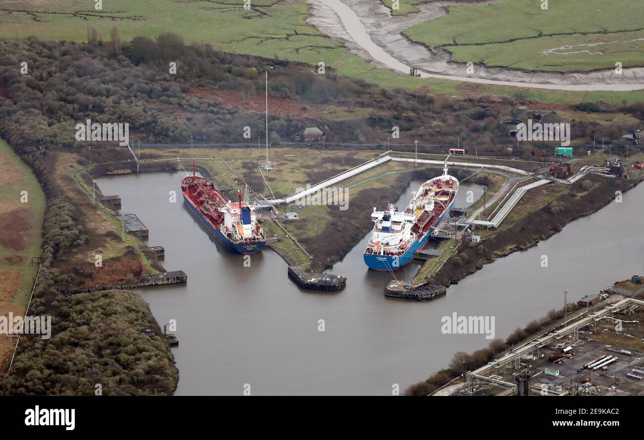 aerial view of two vessels in dock on Manchester Ship Canal at Ellesmere Port. On left: Clyde Fisher (Nassau). On right: Bro Designer (Copenhagen) Stock Photo