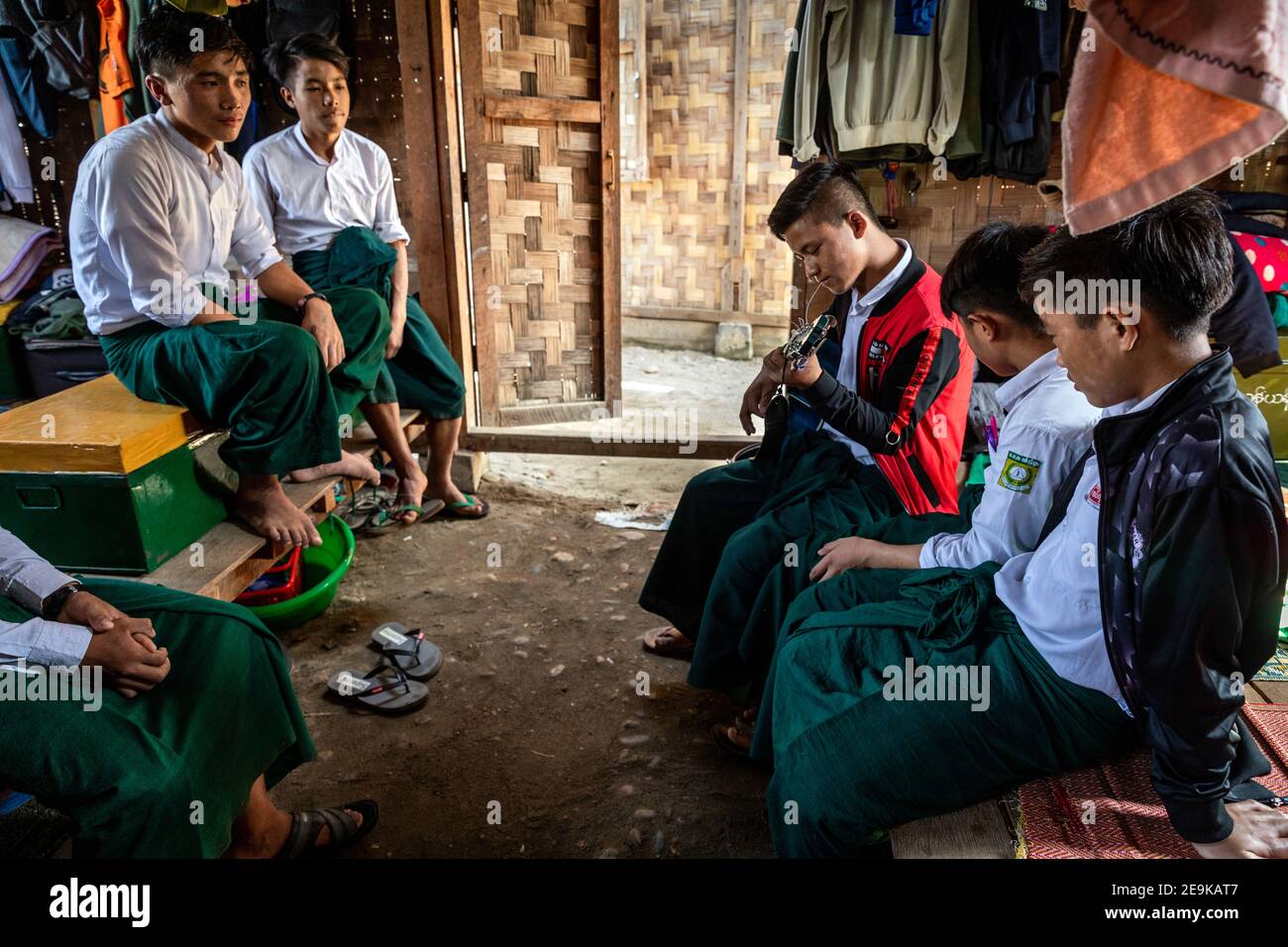The students, most of whom are orphans who fled the civil war, come to their Chinpwi Education Boarding School in Myikyina, Myanmar, during their lunch break. Stock Photo