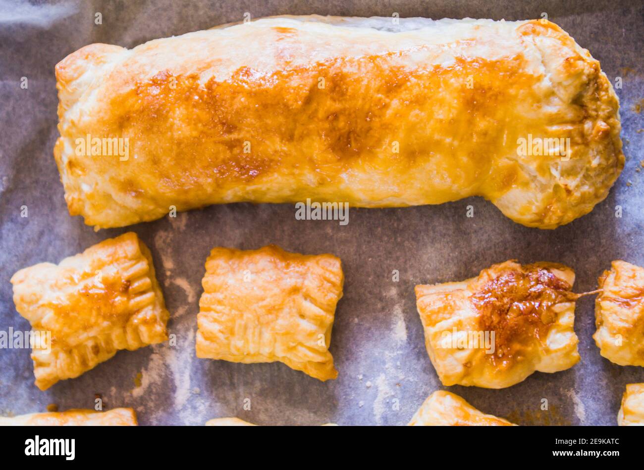 preparation of homemade savory snacks with puff pastry, mortadella