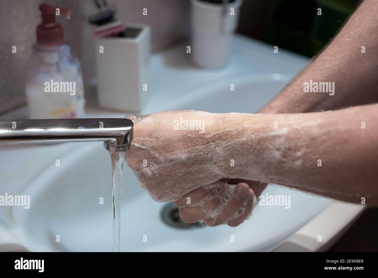 hand washing with liquid soap at home, hygiene and prevention of coronavirus and various infectious diseases Stock Photo