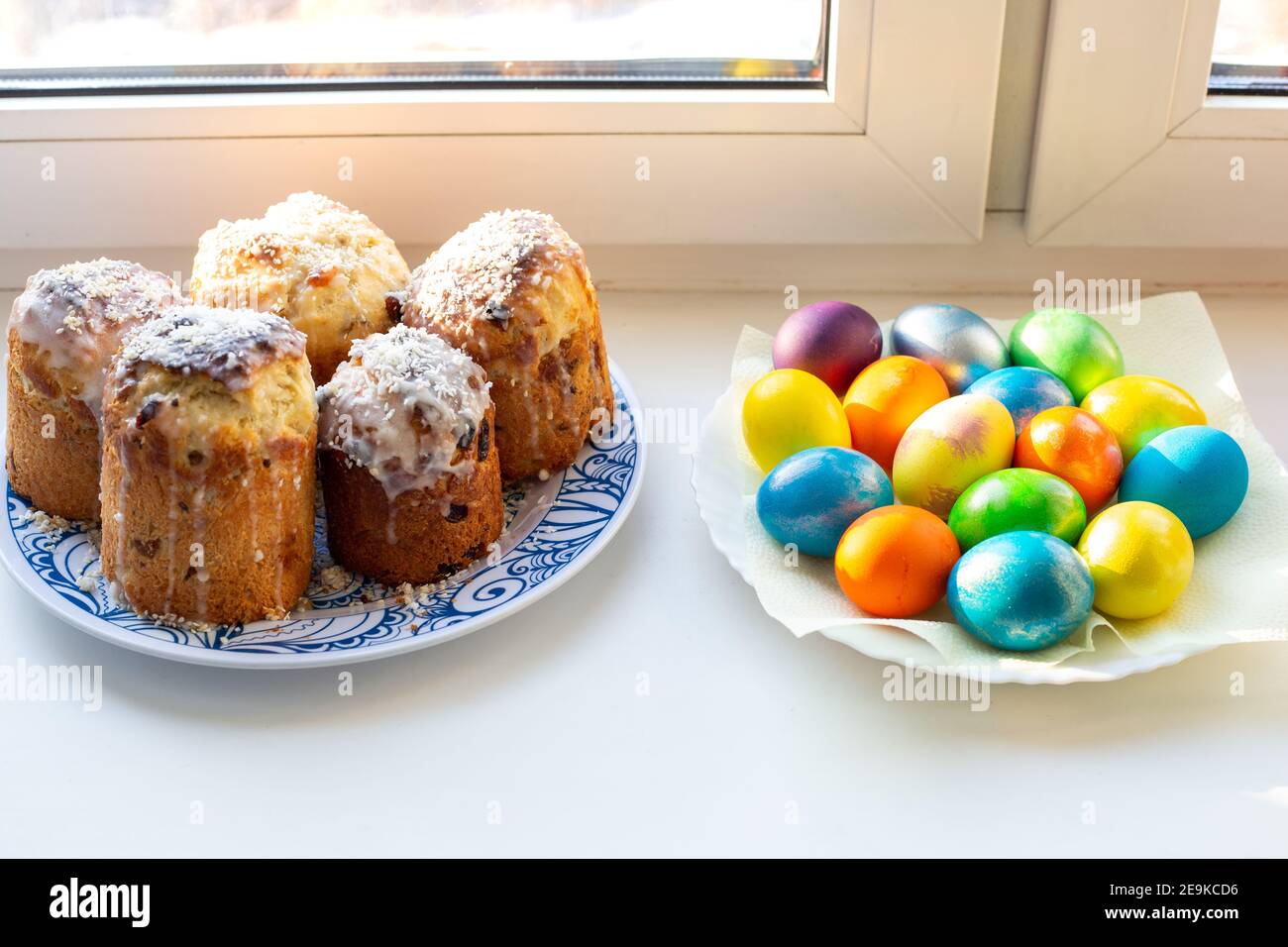 colored multi-colored homemade eggs and cakes for Easter, celebration of the great holiday Stock Photo