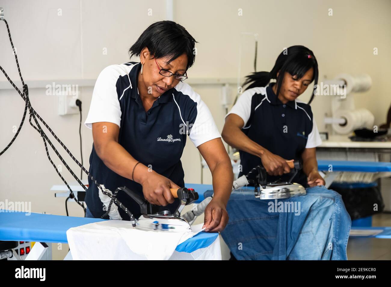 Johannesburg, South Africa October 2, 2012 Young Black woman ironing