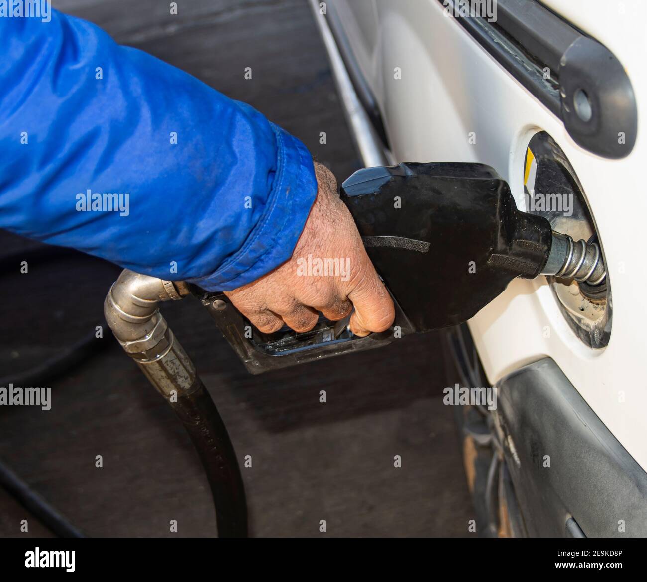 Gasoline fuel nozzle pumping handle for refueling man. Vehicle
