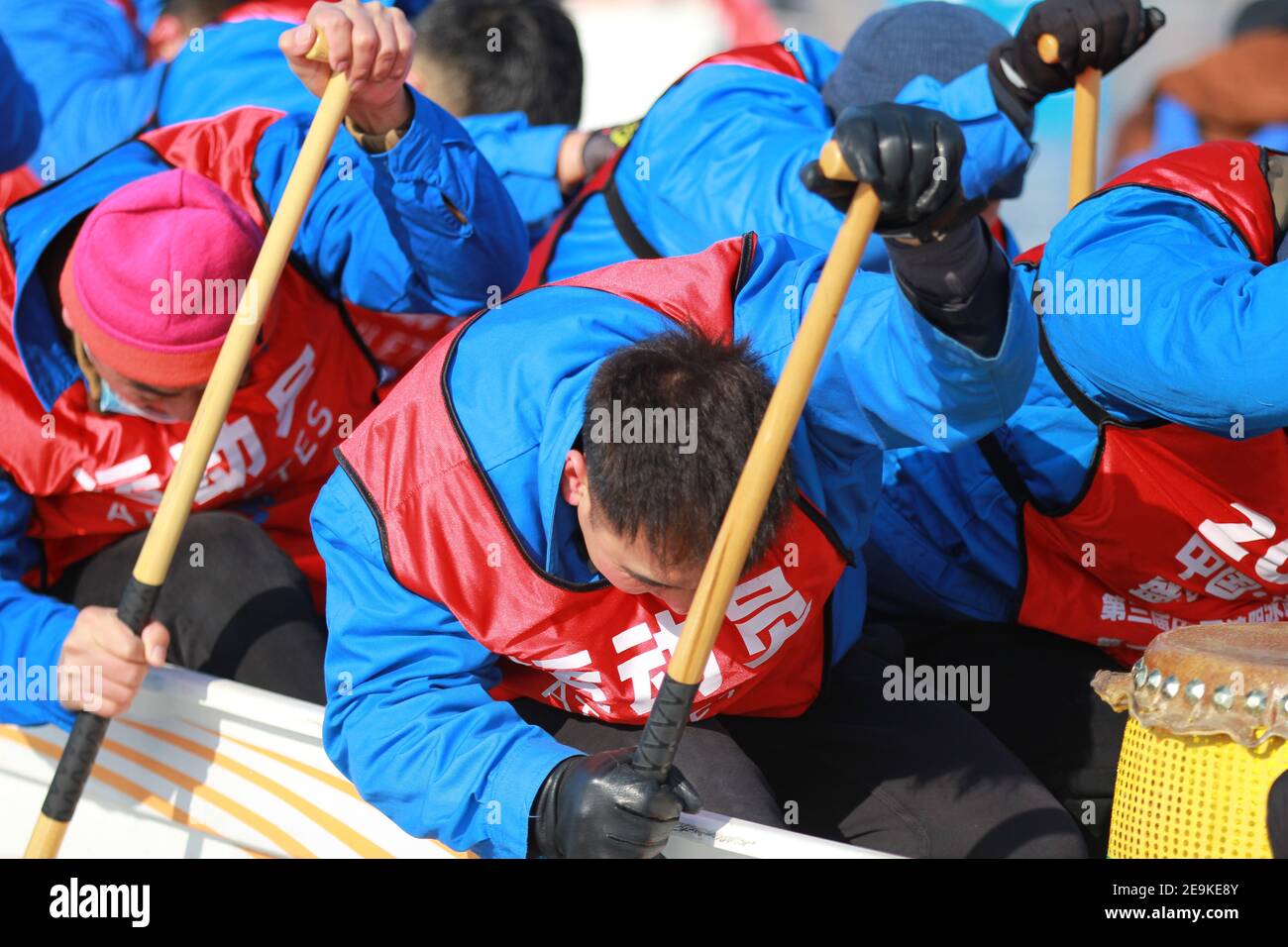 Photo shows people participate in ice dragon boats competition in Shenyang City, northeast China’s Liaoning Province, 2 February 2021. The 3rd Shenyang International Ice Dragon Boat Race kicked off on Tuesday in Shenyang to promote winter sports. Stock Photo