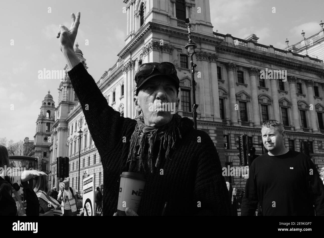 LONDON - 30TH MARCH 2019: A brexit supporter showing a peace sign during a protest outside Parliament in London. Stock Photo