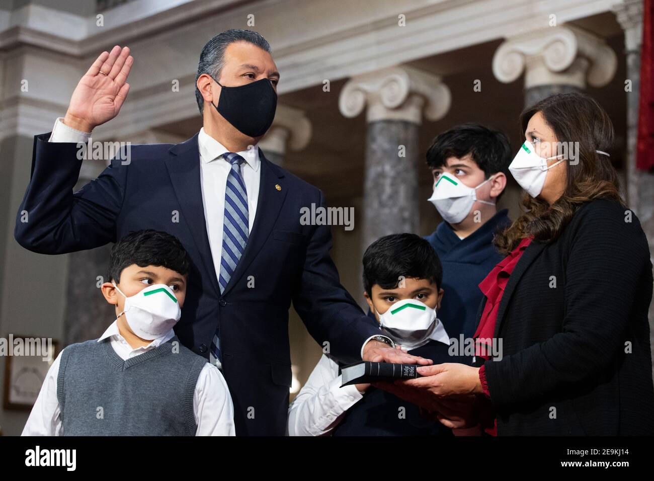 Democratic Senator from California Alex Padilla (Back L), participates in a ceremonial swearing-in with members of his family (L to R); son Diego Padilla (age 6), son Alex Padilla (age 7), son Roman Flores (age 13), and spouse Angela Padilla (R), in the Old Senate Chamber on Capitol Hill in Washington, DC, USA, 04 February 2021. (Photo by Pool/Sipa USA) Stock Photo