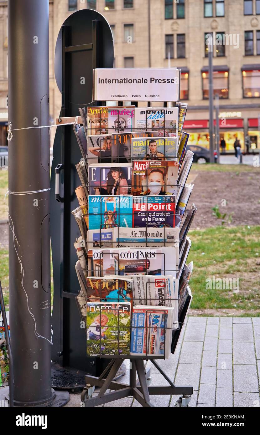 Close-up of a magazine and newspaper stand with international press from France, Poland and Russia at a kiosk in downtown Düsseldorf. Stock Photo