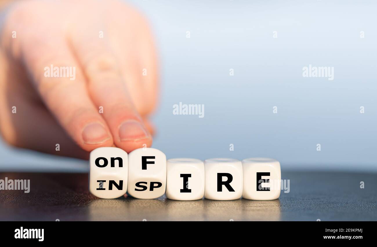 Dice forms the expressions 'inspire' and 'on fire'. Stock Photo