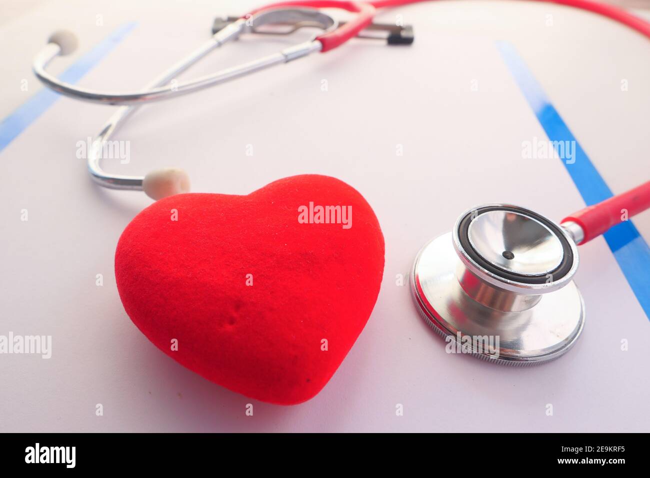 heart shape symbol and stethoscope on white background Stock Photo - Alamy