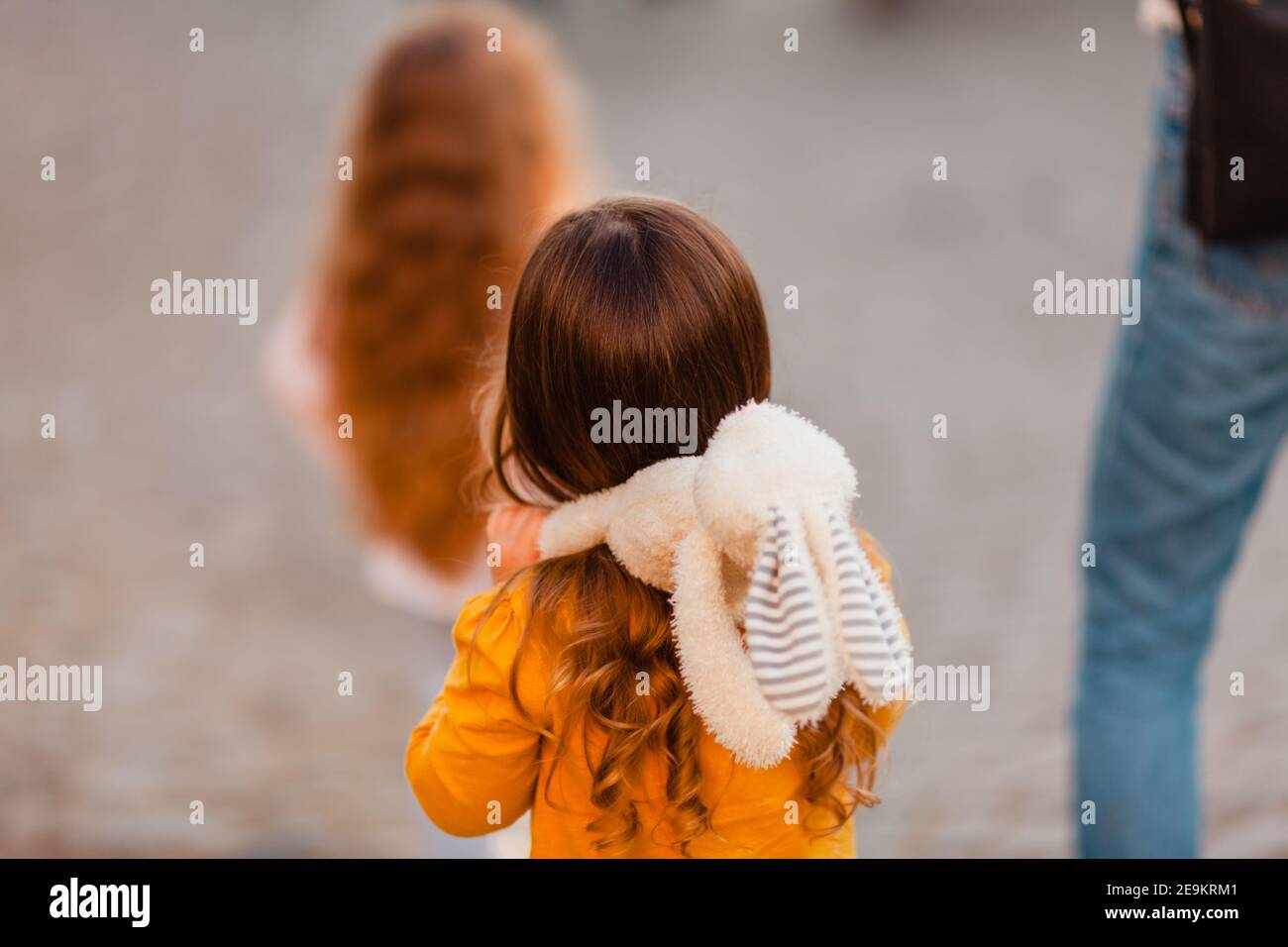 the cute little girl is hugging soft toy during walking Stock Photo - Alamy