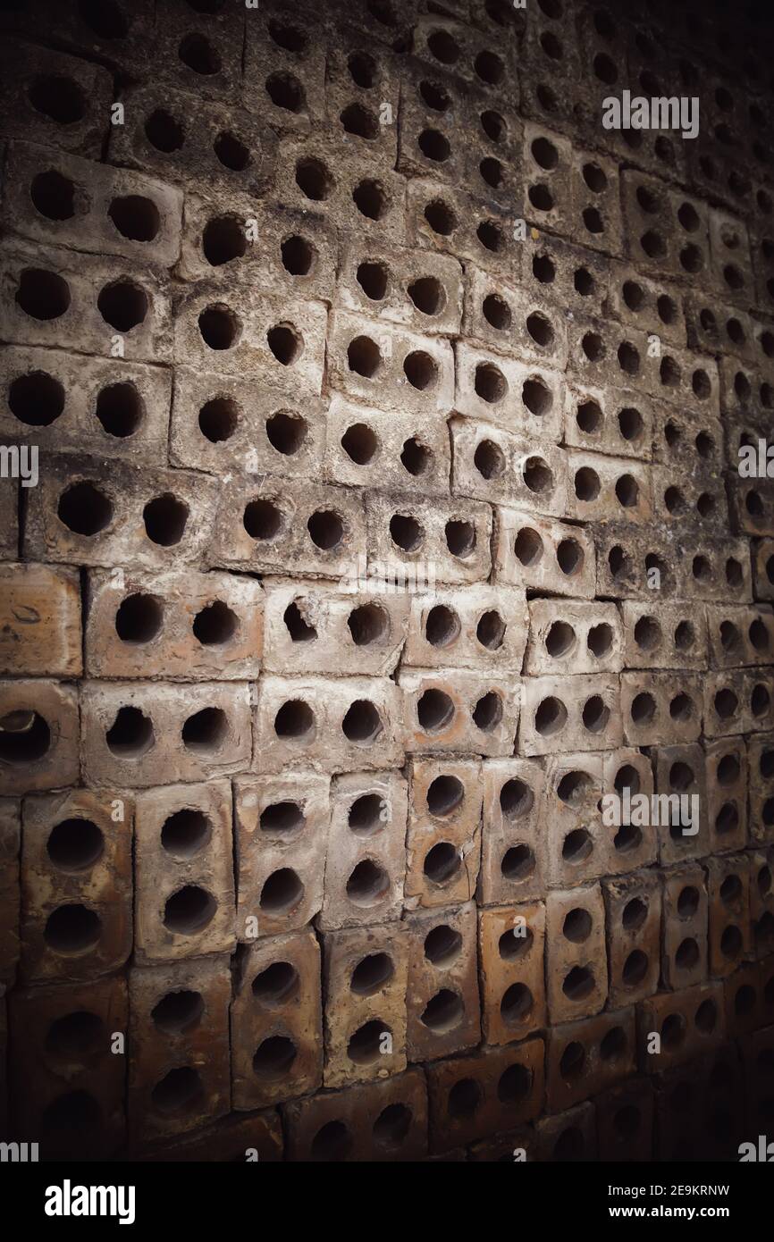 Detail of old mud brick wall with holes, construction Stock Photo Alamy