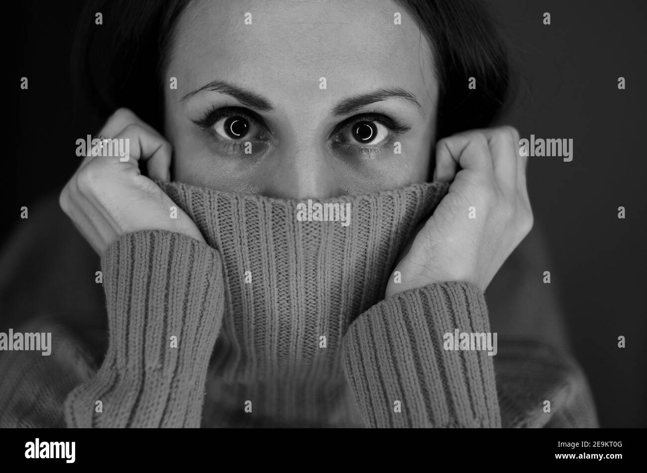 Black and white portrait of a scared woman Stock Photo