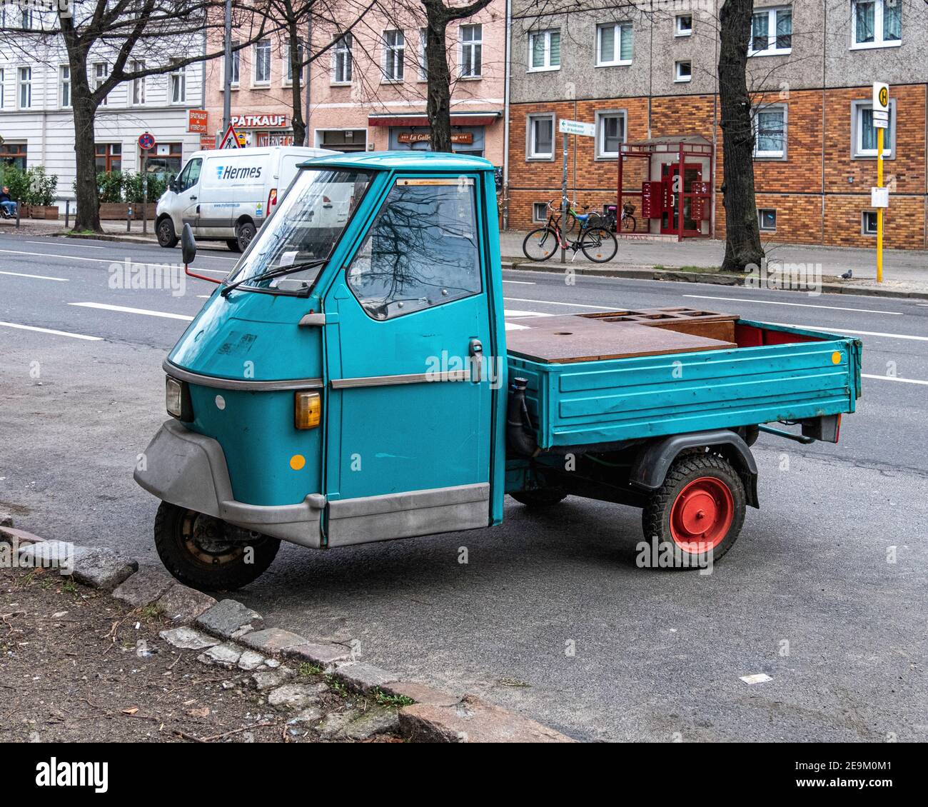 Piaggio Ape - Turquoise.three wheeled delivery van parked in urban street. Vehicle with three wheels, Torstrasse, Mitte,Berlin,Germany Stock Photo