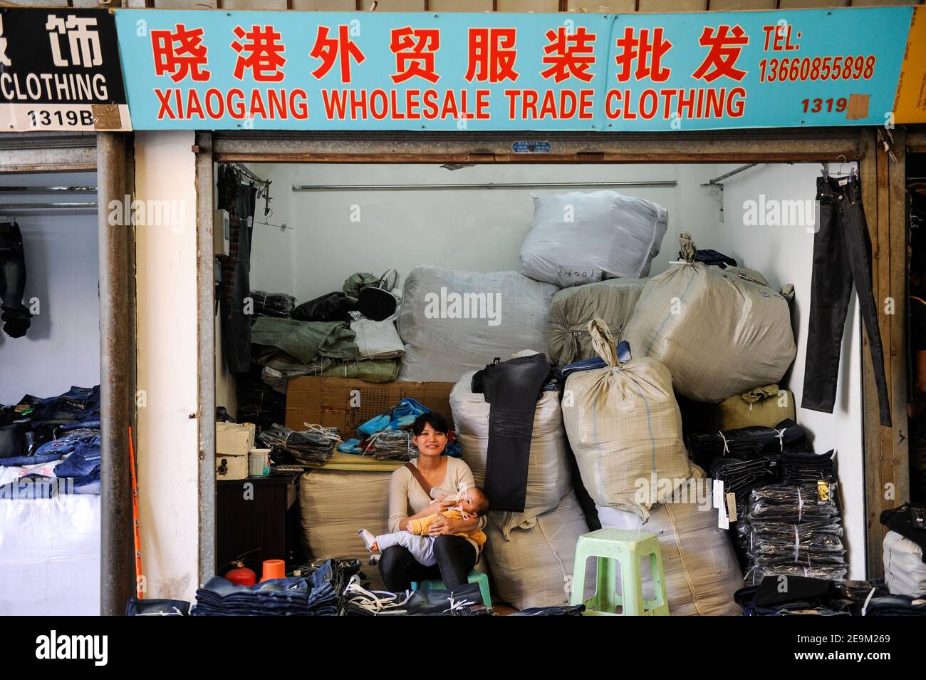 CHINA Guangzhou , export- and wholesale market Canaan Export Center, showrooms with Jeans for international buyers Stock Photo