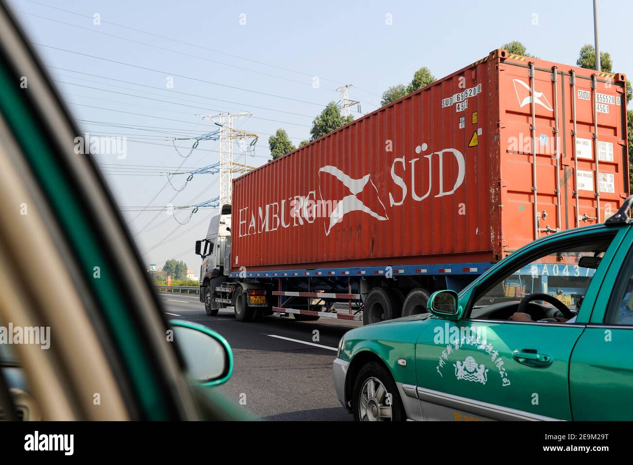 CHINA , Province Guangdong , Guangzhou, Kanton , truck with Container of german shipping company Hamburg Süd Stock Photo