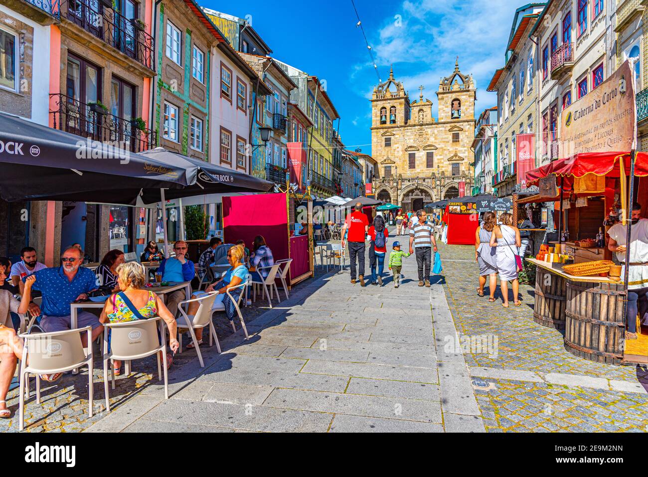 BRAGA, PORTUGAL, MAY 23, 2019: People are strolling on a street leading to the old cathedral in the historical center of Braga, Portugal Stock Photo