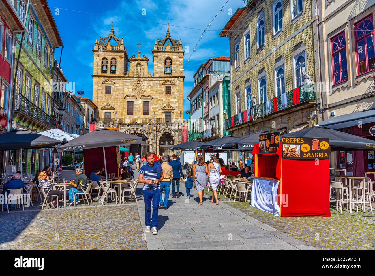 BRAGA, PORTUGAL, MAY 23, 2019: People are strolling on a street leading to the old cathedral in the historical center of Braga, Portugal Stock Photo