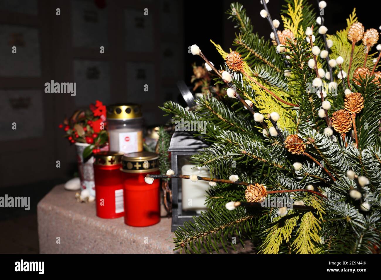 Lighting candles for the dead on All Saints Day Stock Photo Alamy