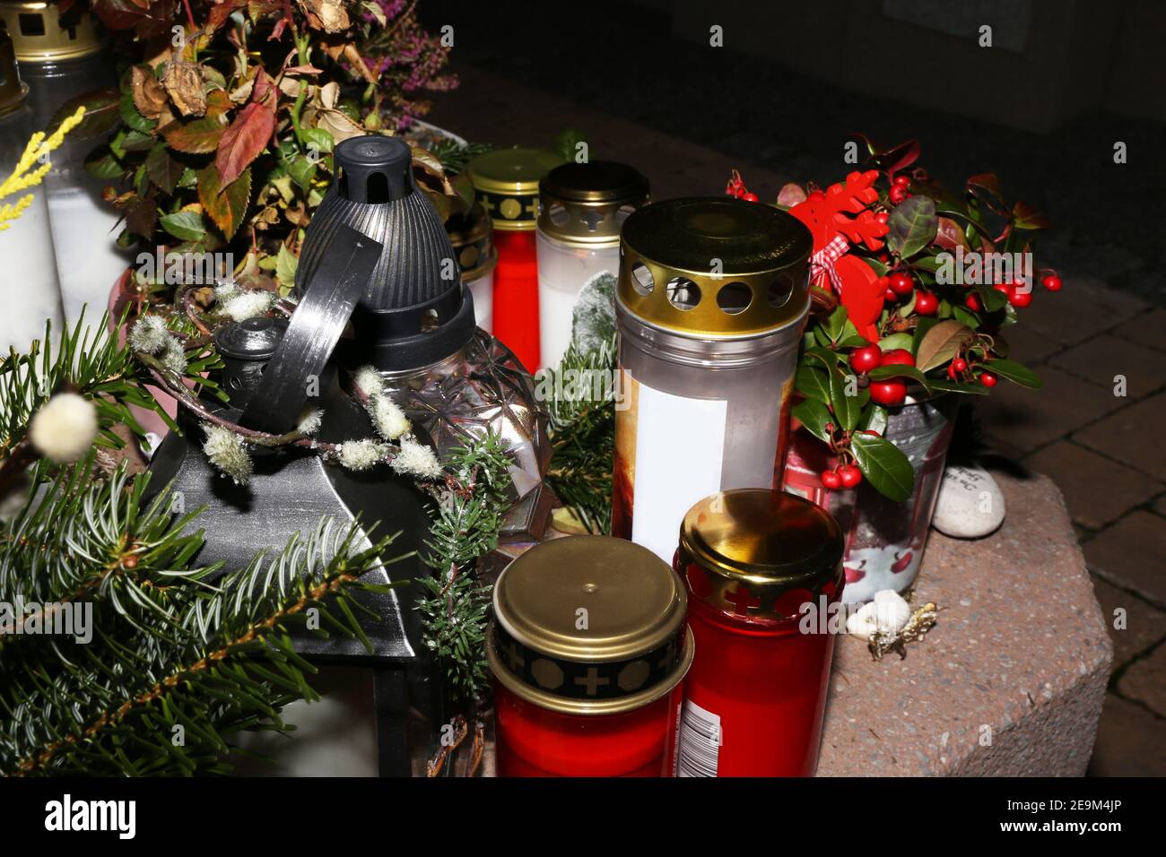 Lighting candles for the dead on All Saints Day Stock Photo Alamy